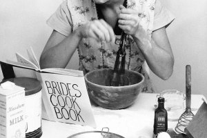 Woman using hand mixer