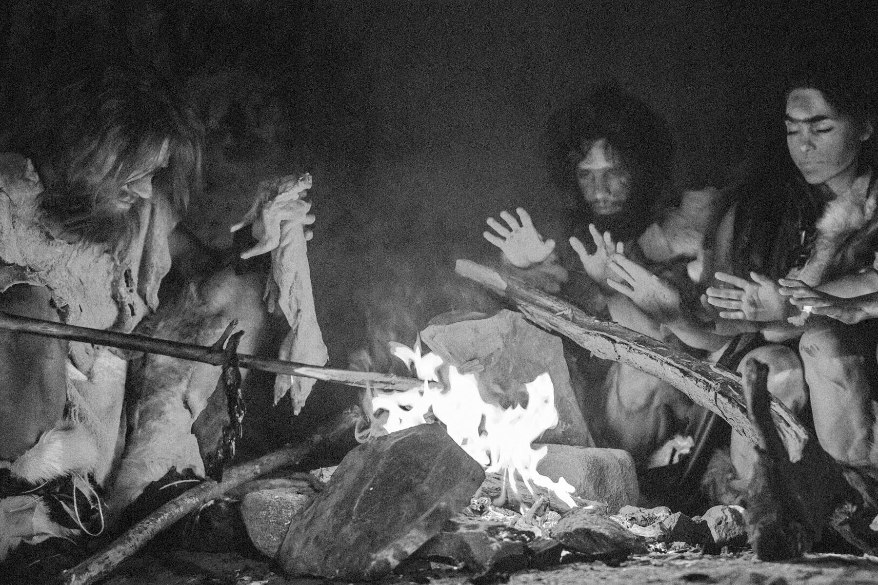 Early humans making fire